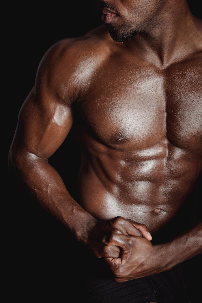 Powerful display of a muscular man's torso highlighting fitness and strength.